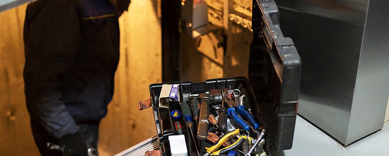 Elevator technician in elevator shaft