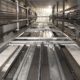 An elevator shaft containing elevator equipment installed by an elevator company. We help elevator company owners and manufacturers partner with skilled and highly-trained elevator technicians and mechanics who focus on the importance of safety, professionalism, and continuous education and training.